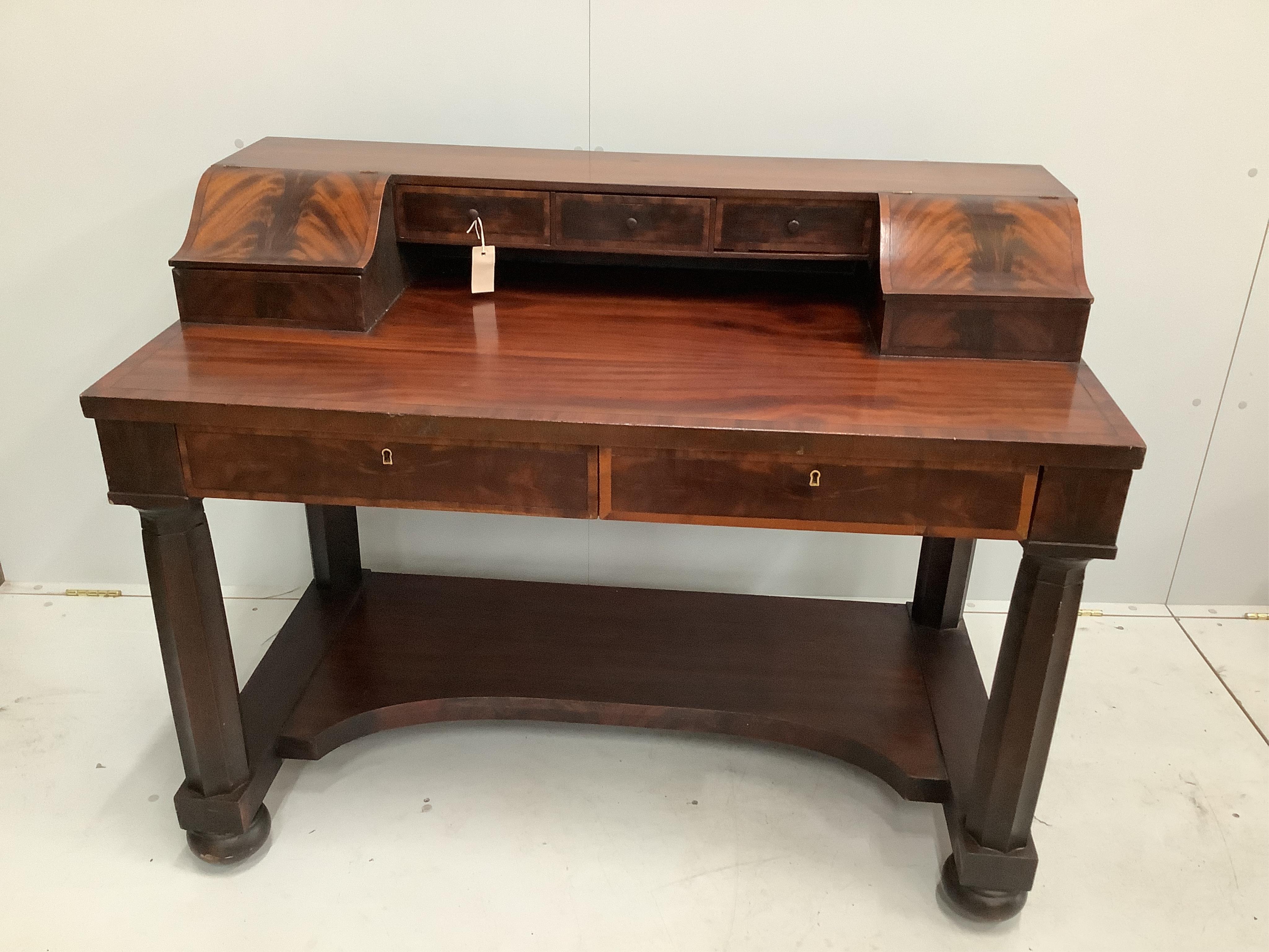 A reproduction mahogany writing desk, width 122cm, depth 65cm, height 94cm